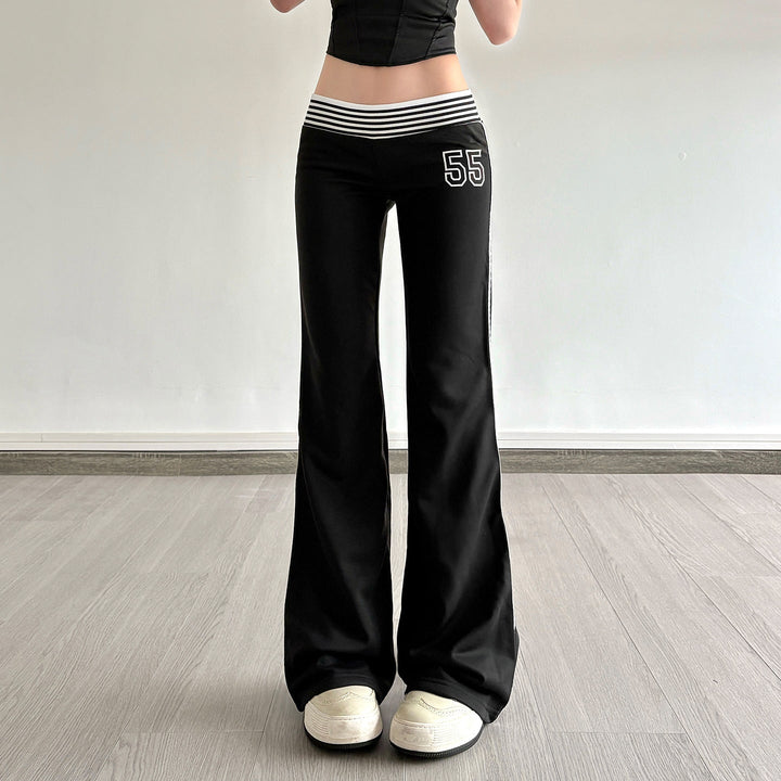 Dame flared joggebukse med sporty sidestriper, perfekt for casual vår- og sommerstil. Ultimativ komfort.