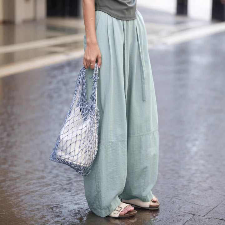 Elegante hvite vide damebukser med knytebelte, perfekt for casual stil eller fritid. Høy midje.