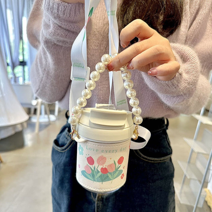 Elegant dame termosflaske med perlehåndtak. Perfekt for kaffe, te eller vann, holder drikken varm/kald lenge.