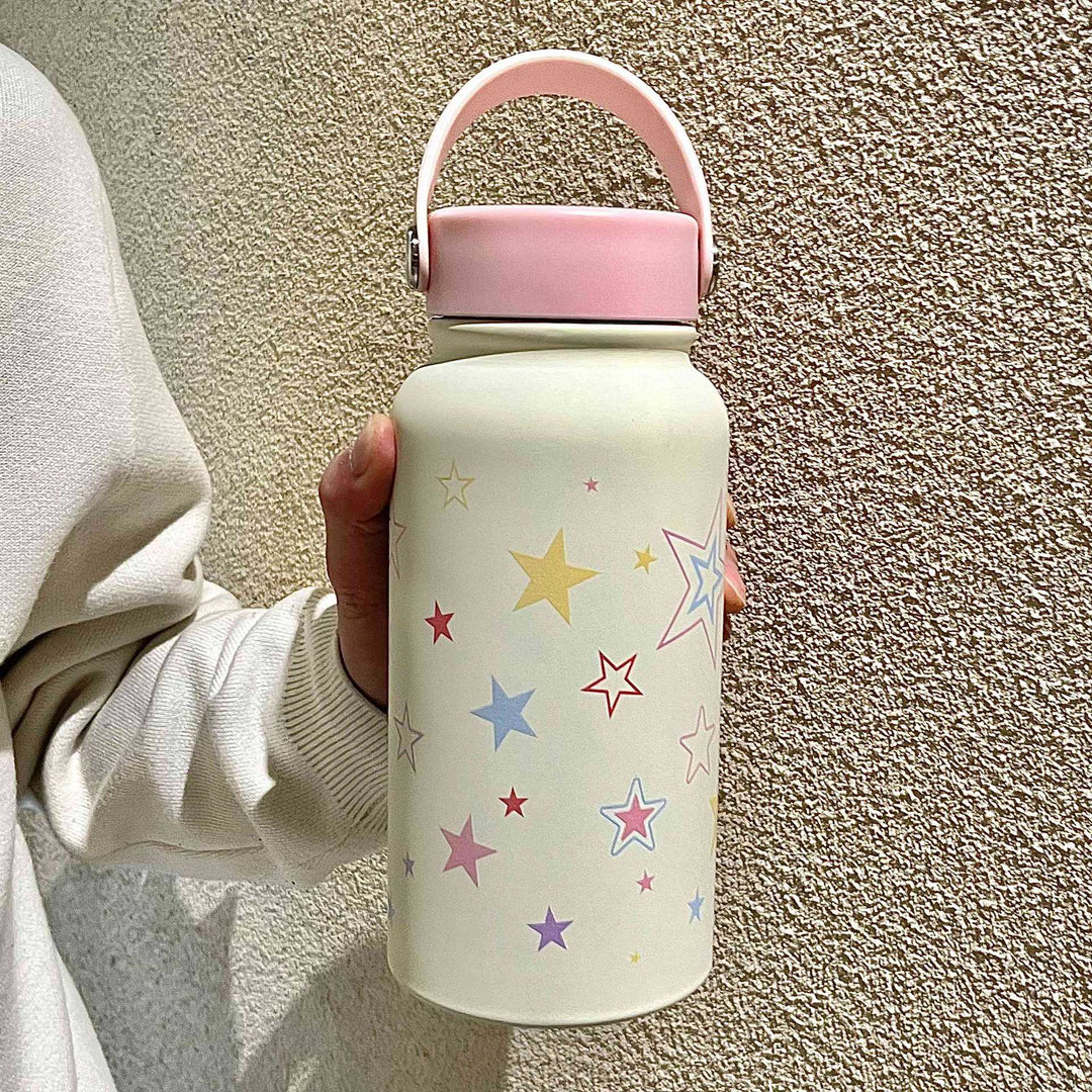 Rosa isolert drikkeflaske for kvinner, 900ml, med stjernemotiv. Ideell for trening, skole eller kontorbruk.