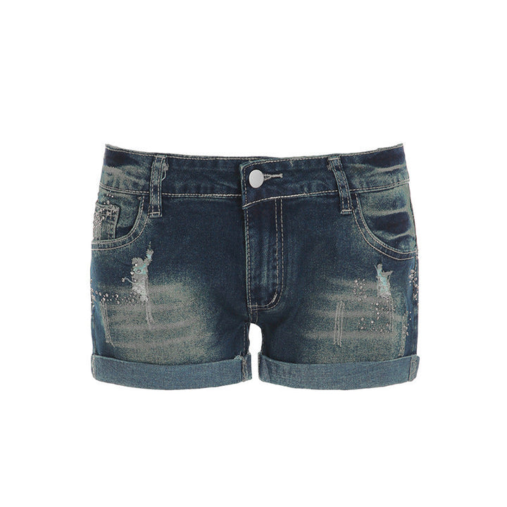 Allsidige blå glitrende jeansshorts for damer. Fra hverdag til fest, alltid med stil og komfort.