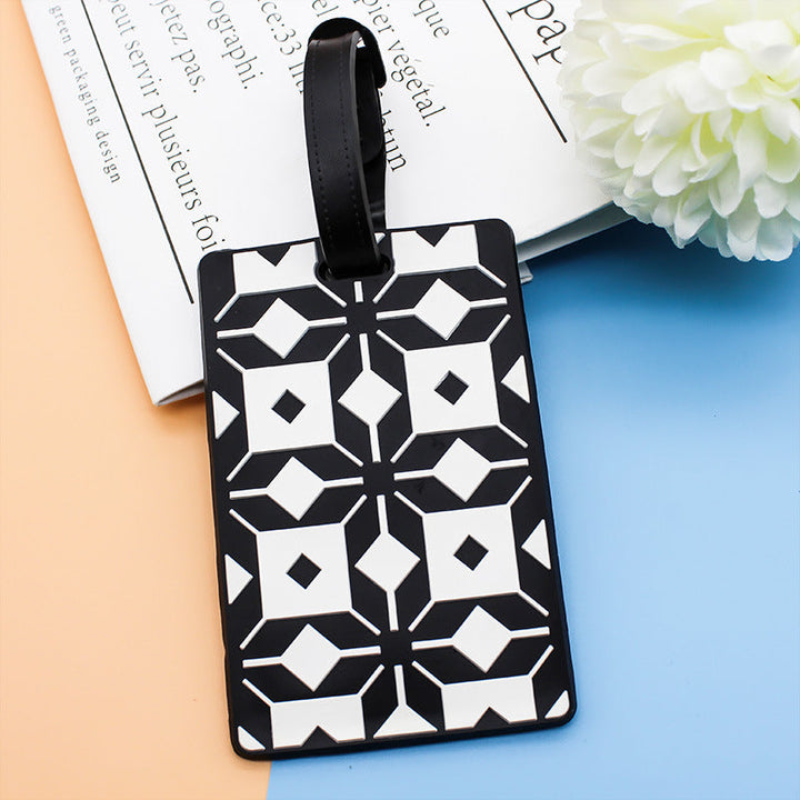 Distinkt geometrisk mønstret bagasjelapp for dame, gjør din koffert lett å finne på alle reiser.