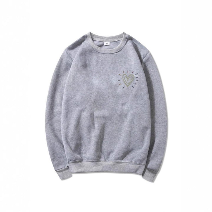 Avslappet oversized damegenser med unikt søtt hjerte-motiv. Perfekt for en komfortabel look.