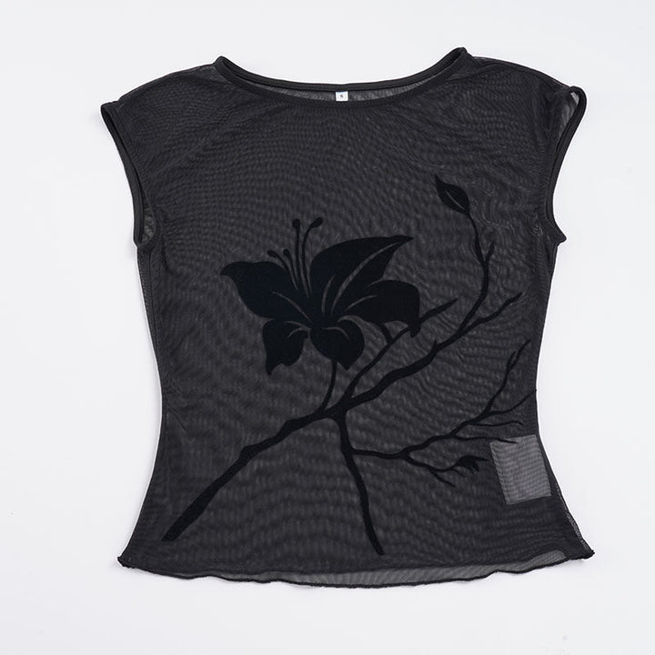 Moteriktig langermet damebluse med gjennomsiktig design og blomstertrykk. Passer til både hverdag og fest.