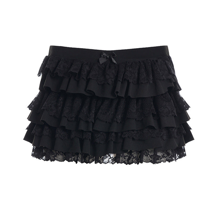 Feminin kortere volangskjørt for kvinner med unike spissdetaljer. Et moderne dameskjørt for sommer og fest.