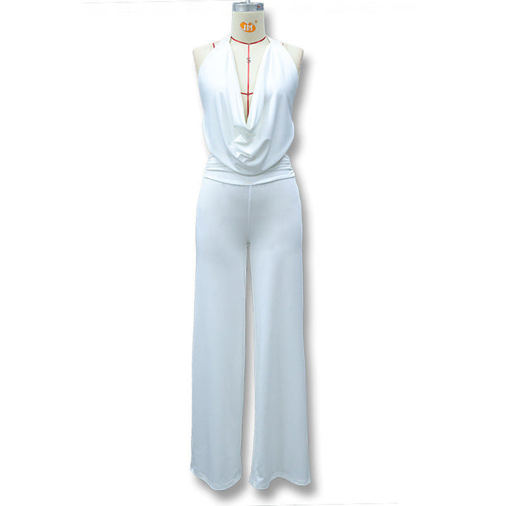 Elegant dame jumpsuit med v-hals og vide ben, tilgjengelig i svart og hvit, for et sofistikert sommerantrekk.