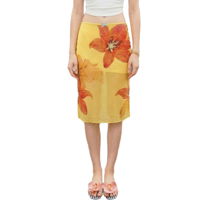 Elegant blomstrete midi skjørt for dame i gul farge, med elastisk midje, ideelt for hverdag og fest.