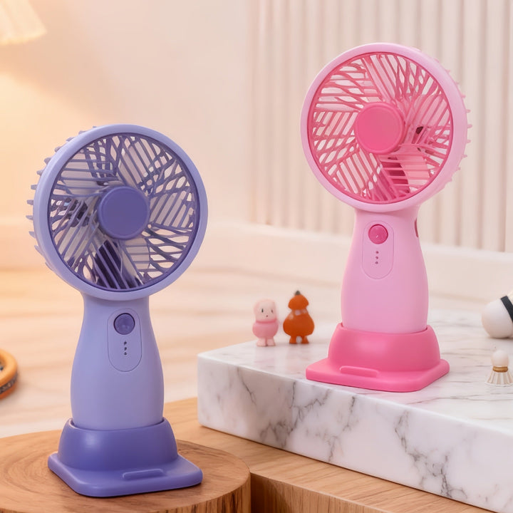Bærbar USB håndvifte for kvinner, kompakt og rosa, gir kjølig komfort på farten.