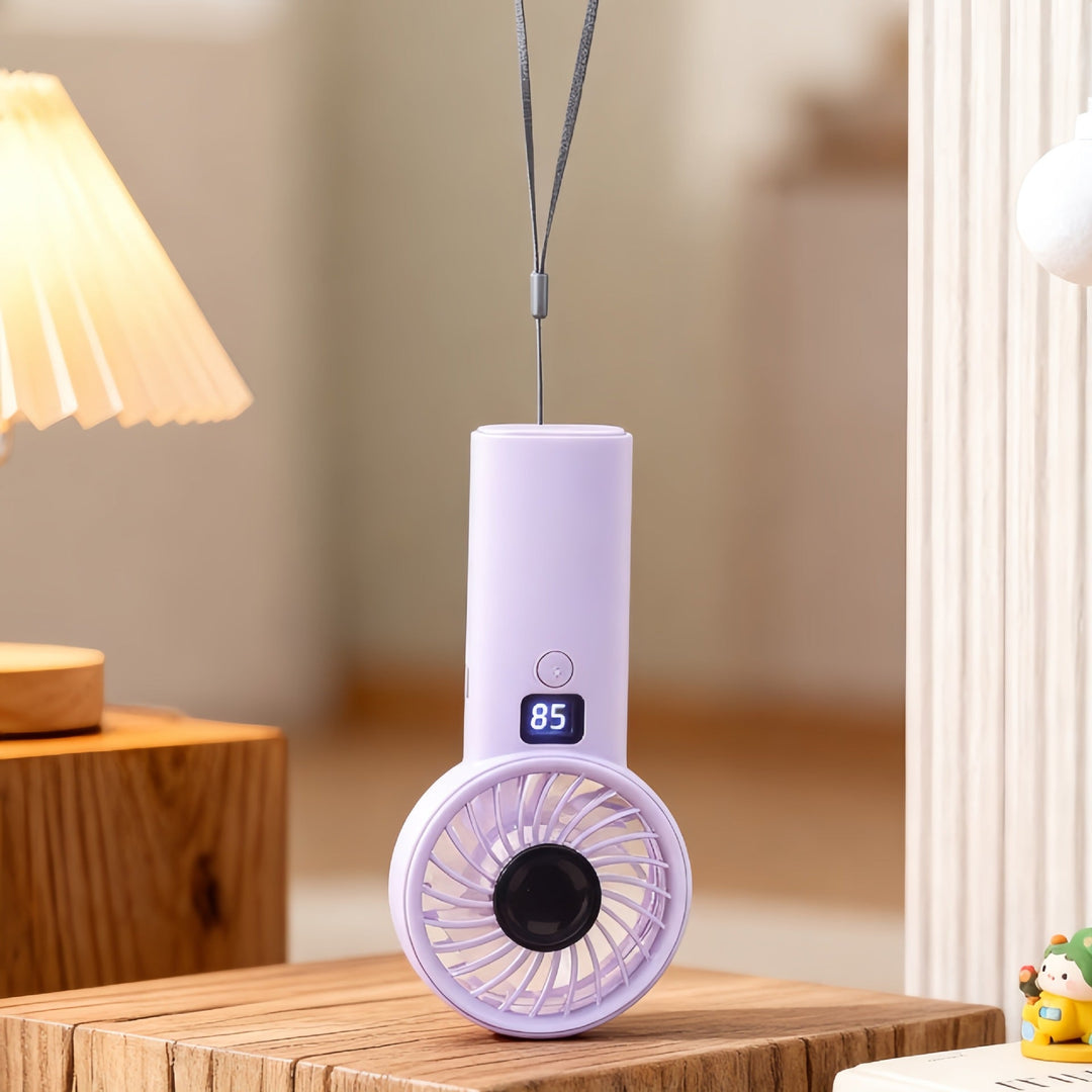 Kompakt USB-ladet minivifte, ideell for reise, kontor eller utendørs bruk på varme sommerdager.