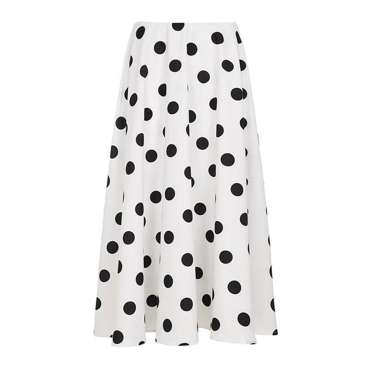 Tidløst maxiskjørt med polkadot prikker, behagelig og elegant for alle sommerlige anledninger.