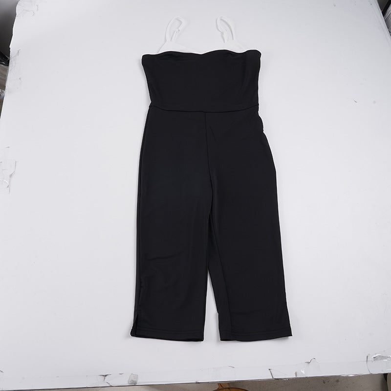 Elegant svart dameoverall med justerbare stropper, vide ben og minimalistisk design. Perfekt for en chic look.