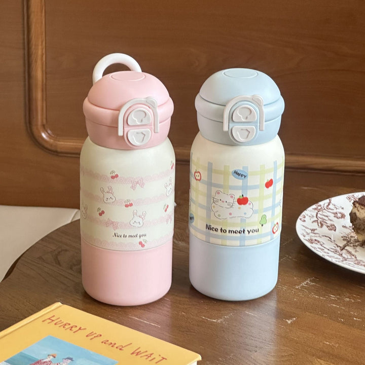 Rosa isolerende 500ml termoflaske med muntert design og klapplokk. Gjenbrukbar og stilfull for kvinner.