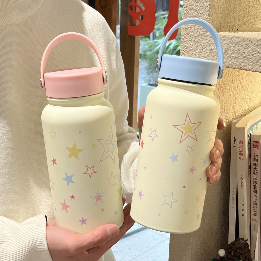 Isolert drikkeflaske for kvinner, 900ml, med lekent stjernemotiv. Perfekt for sport, kontor og skole. BPA-fri.