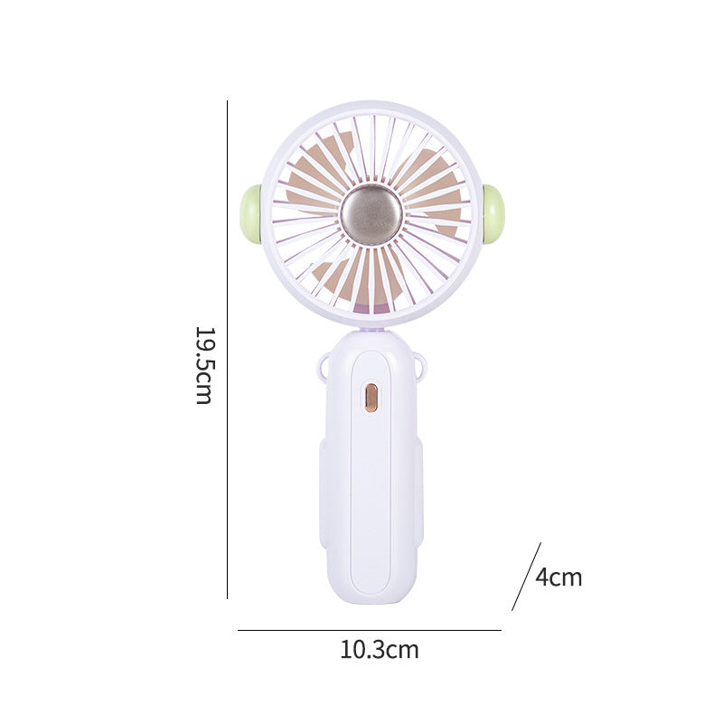 Unik tegneserievifte, håndholdt og kompakt for kjøling på farten. En søt, bærbar sommer-gadget.