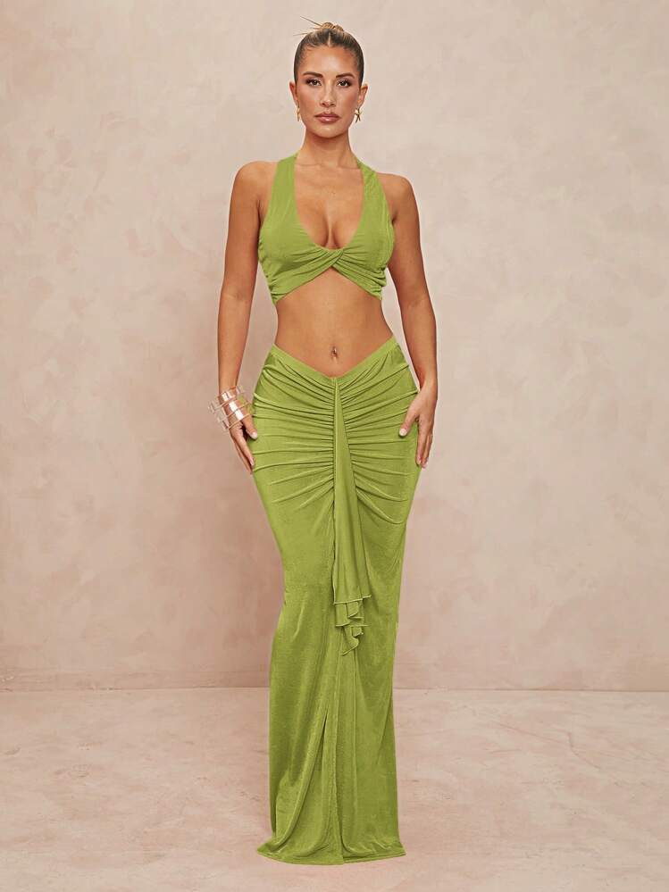 Lett og elegant damesbodysuit med kryssrygg og sidesnitt, perfekt for en komfortabel sommerfest.