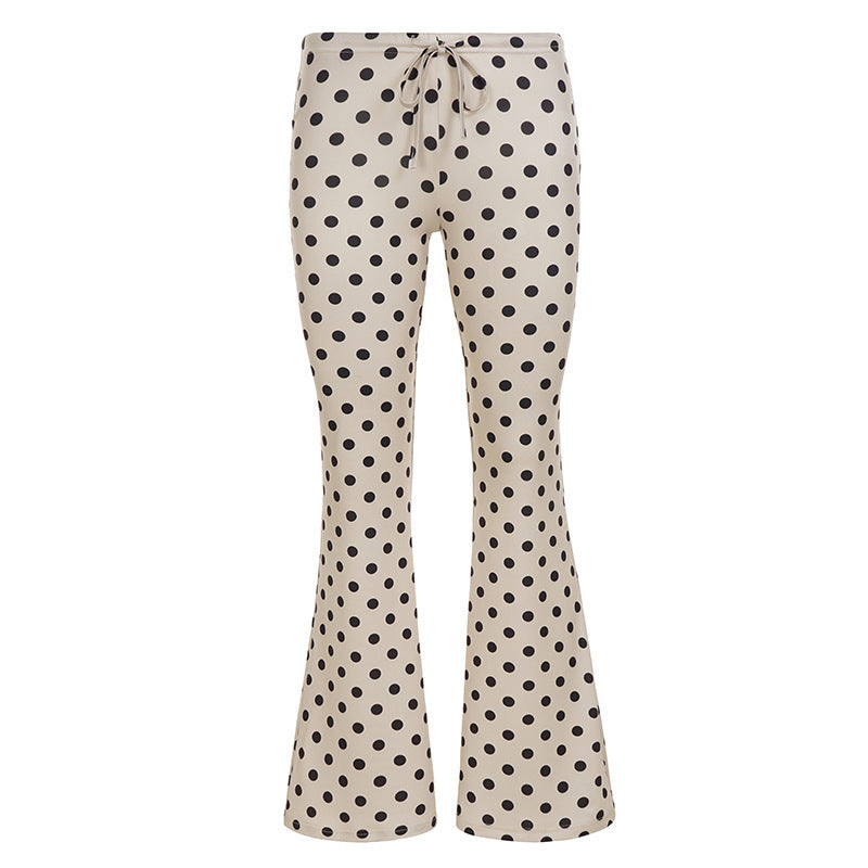 Damebukser i khaki med prikker, vide flared ben og høyt liv. Trendy, komfortable og stilige for enhver anledning.