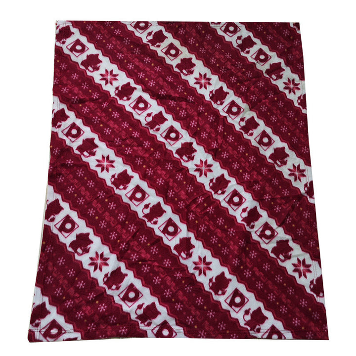 Dekorativt juledesign fleece-teppe som tilfører julestemning til stuen, mykt og varmt.