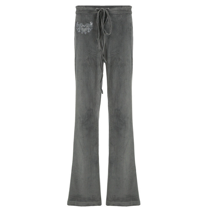 Ryggvisning av grå dame flared sweatpants, som viser den vide passformen og komfortable silhuetten.