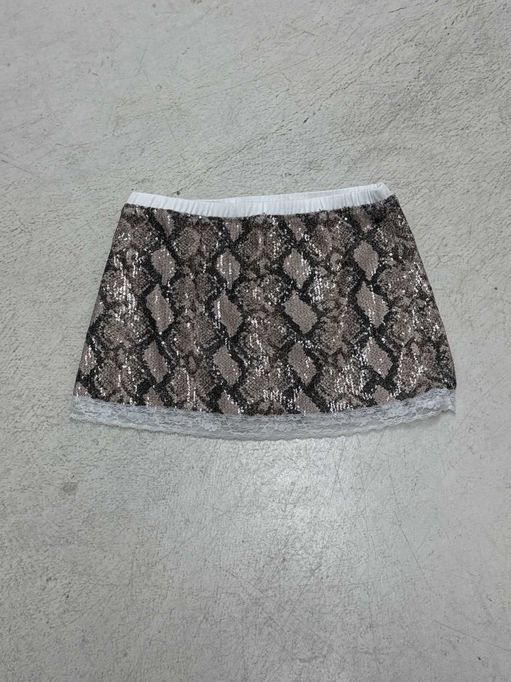 Trendy glitrende slangemønster miniskjørt for damer, med spisskant, et must for sommerens fester.