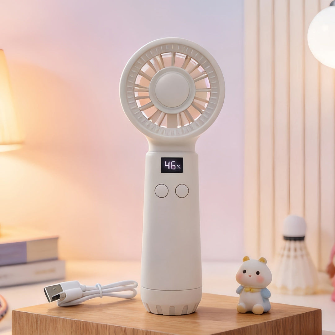 Damer håndvifte med LCD-skjerm på et skrivebord; kompakt og stillegående for kontorbruk.