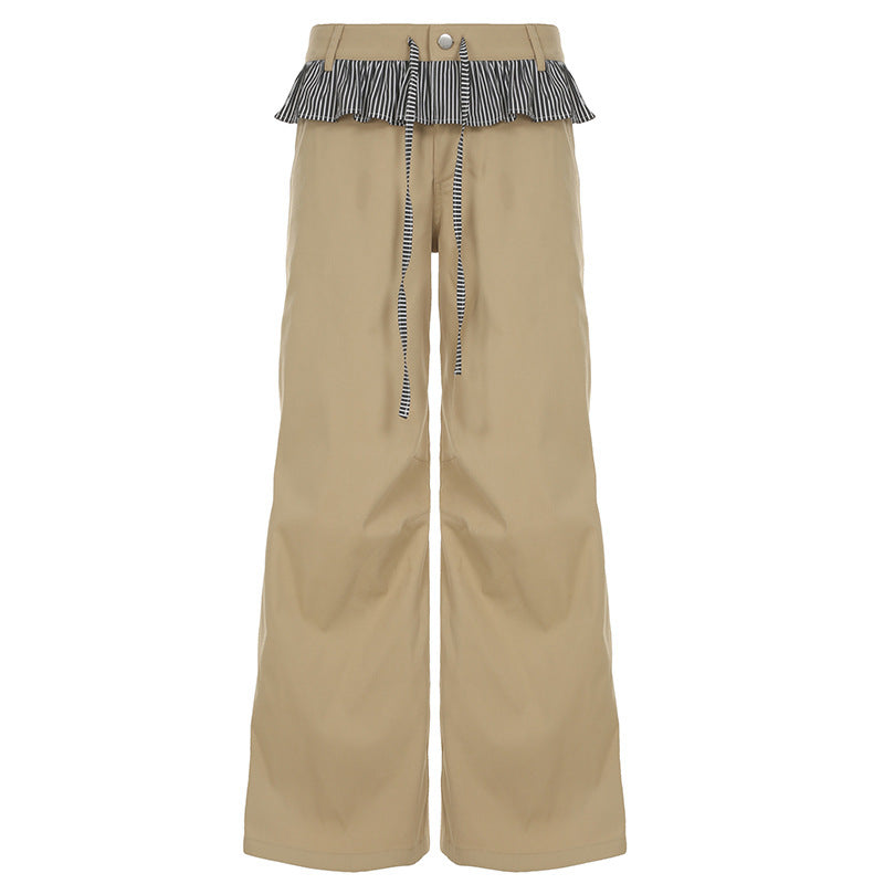 Allsidig bred bukse i khaki til dame. Med trendy rysjer og justerbar midje; ideell for fritid og sommer.