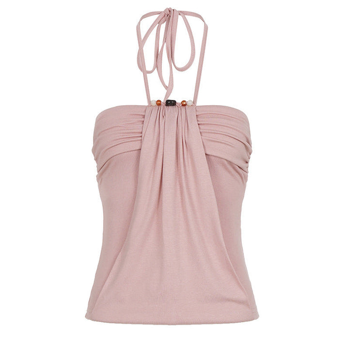 Feminin rosa dame topp med tynne spagettistropper, delikat drapering og perleaksenter.