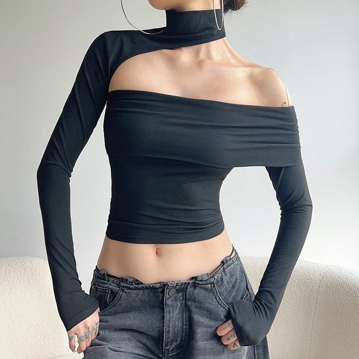 Trendy svart asymmetrisk topp for dame med stilige volangdetaljer. Perfekt for vår og sommer.