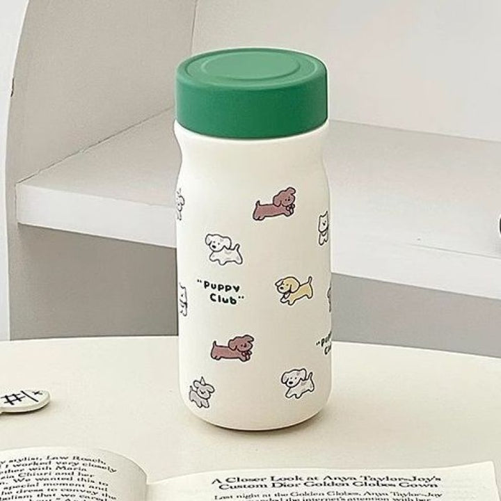 Grønn isolert drikkeflaske for dame med søt valp, holder drikken kald/varm, 320 ml.