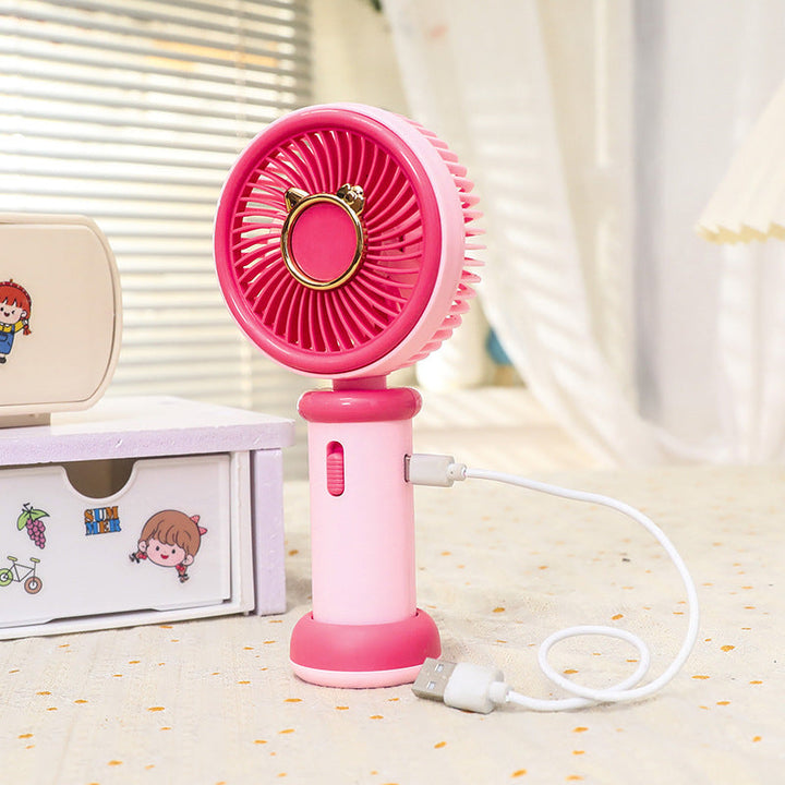 Liten bærbar minivifte med unikt dyredesign. Gir frisk luft og personlig kjøling, USB-ladbar for enkel bruk.