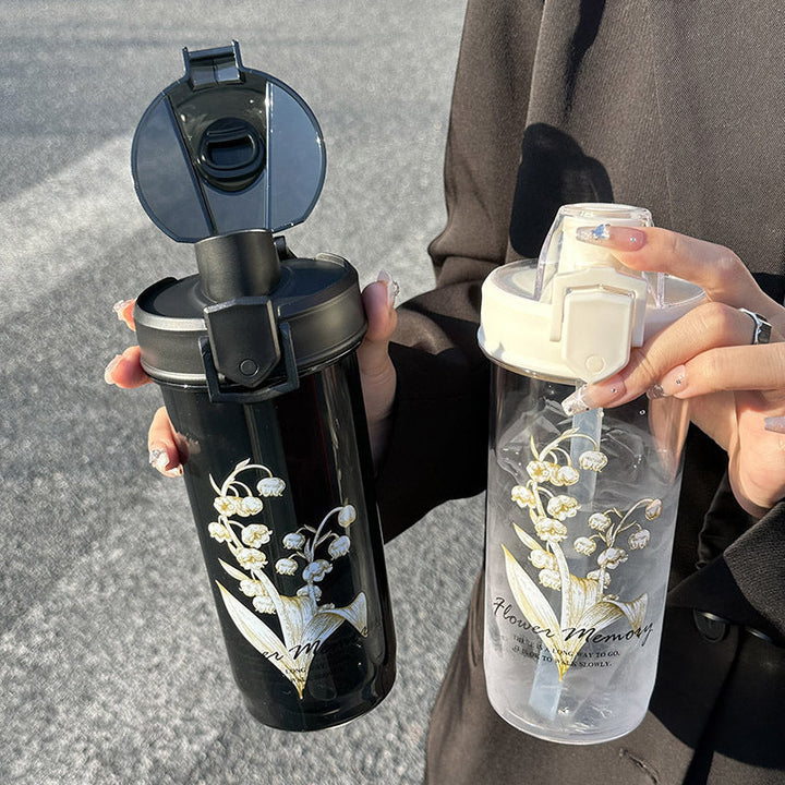 Vakker isolasjons drikkeflaske for damer, med lekkasjefri forsegling og unikt blomstermønster.