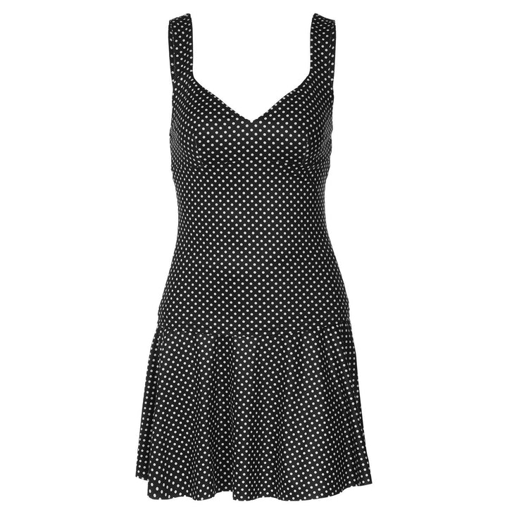 Moderne prikket damekjole med lange ermer. Klassisk A-linje design for en elegant hverdagslook.