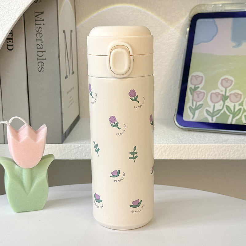 Elegant isolert drikkeflaske for damer, 500ml rustfritt stål med vakkert blomsterdesign. Gjenbrukbar termos.