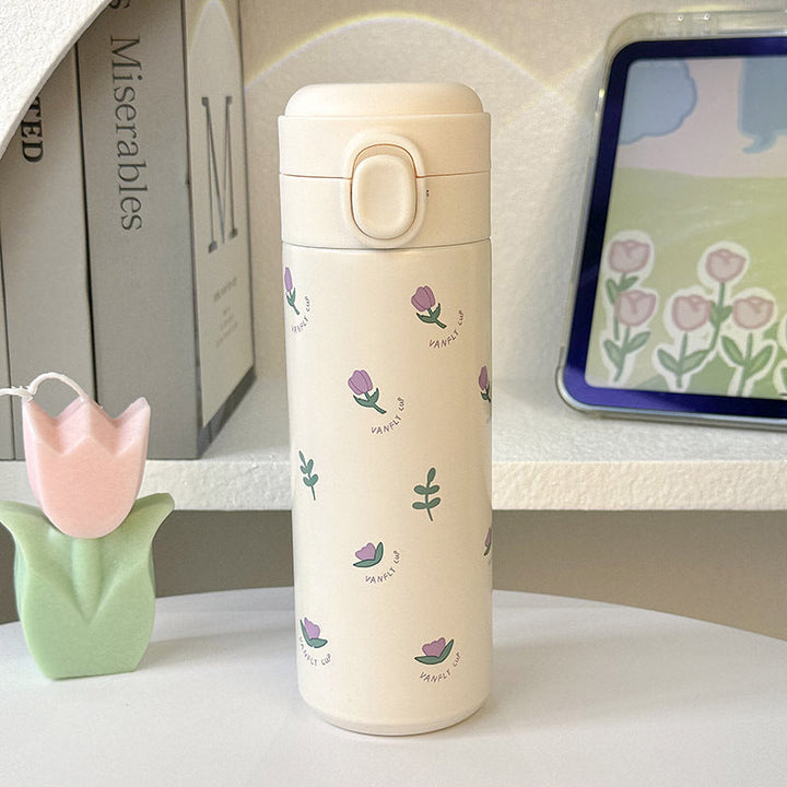 Elegant isolert drikkeflaske for damer, 500ml rustfritt stål med vakkert blomsterdesign. Gjenbrukbar termos.