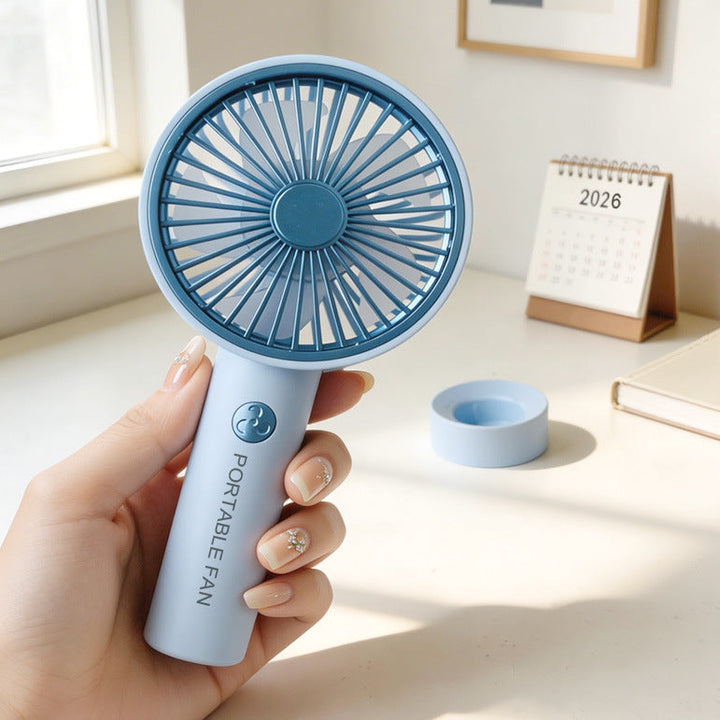 Lett og kraftig håndvifte med oppladbart batteri, optimal for kontoret og hverdagen.