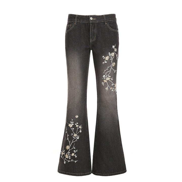 Komfortable flared jeans med høy midje og blomstermønster. Allsidige damejeans for vår, sommer og stil.