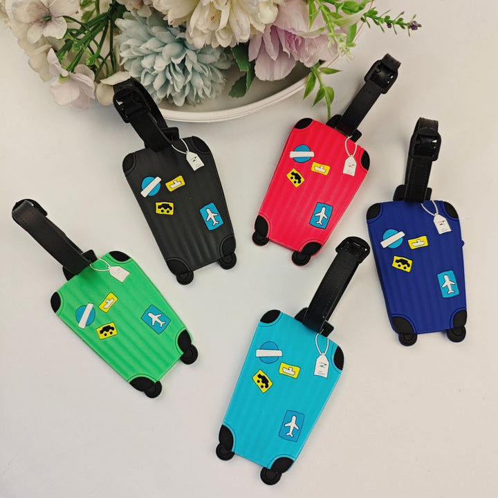 Fargerik silikon bagasjeetikett i lekent reiseveske-design. Perfekt unisex reisetilbehør for bagasje.