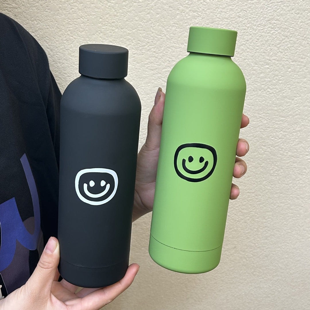 Dame termosflaske 500ml med lekent smiley-ansikt, tilgjengelig i rosa, grønn, svart.