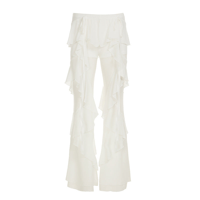 Moderne dame rysjebukser med elastisk midje, flatterende flytende snitt. Elegante hvite sommerbukser.