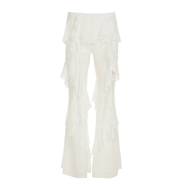 Moderne dame rysjebukser med elastisk midje, flatterende flytende snitt. Elegante hvite sommerbukser.