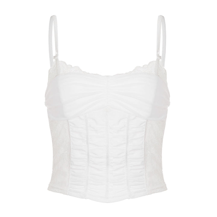 Hvit dame korsetttopp med spiss front og elegant snøring. Figurskapende mote for fest og sommer.