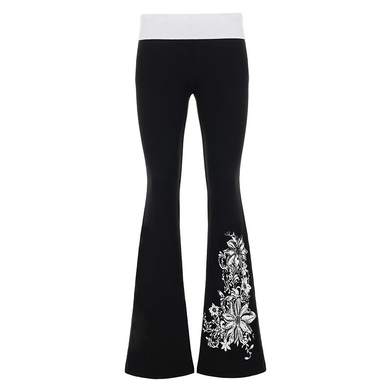 Fasjonable dame yoga-bukser med flared silhuett, høy midje og delikat blomstertrykk for komfortabel fritid.