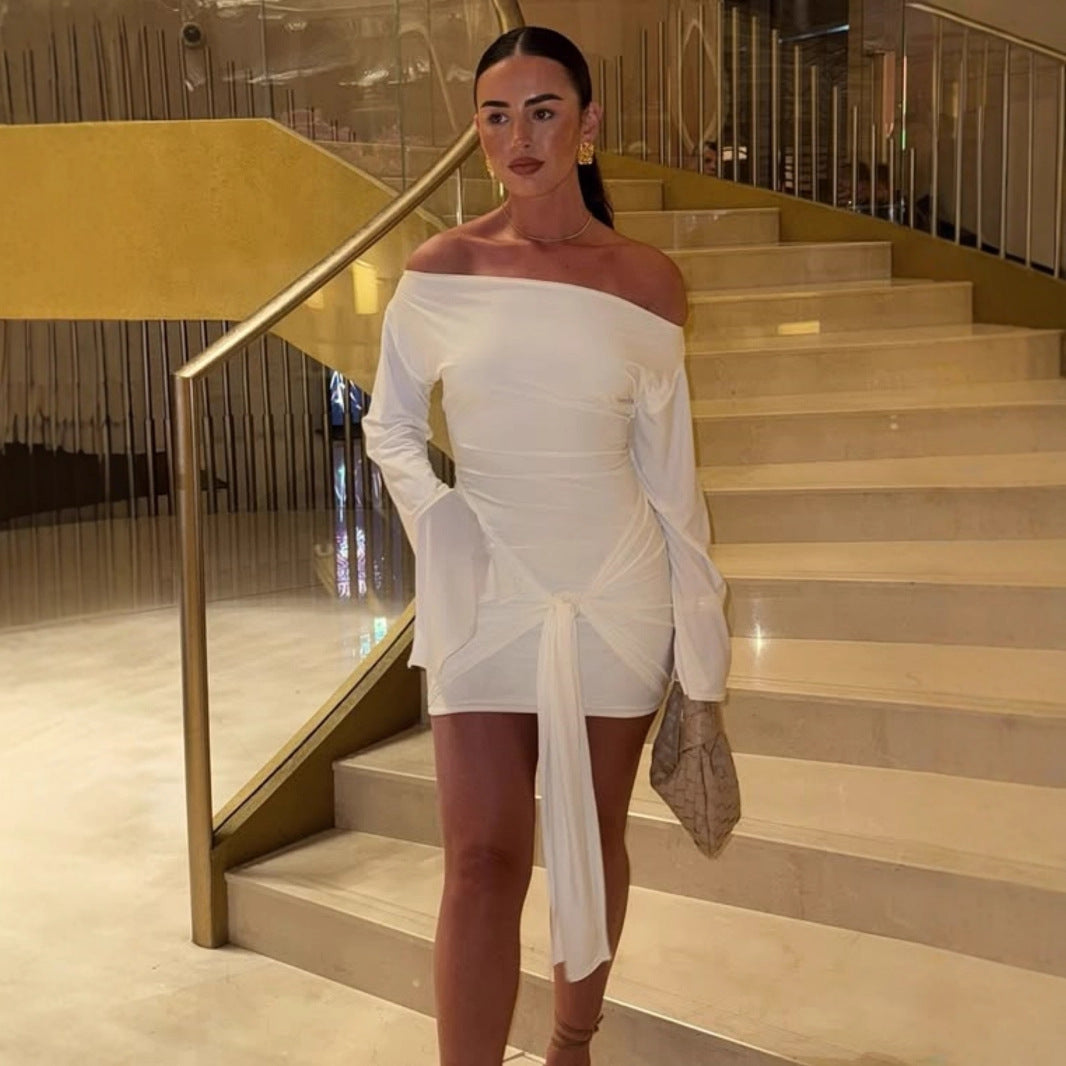 Dame asymmetrisk omslagstopp, langermet, med elegant knutedetalj. Perfekt for hverdag og fest.