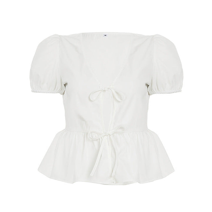 Vårens elegant innpakningsbluse med puffermer og peplum. En stilfull damebluse som passer til ulike anledninger.