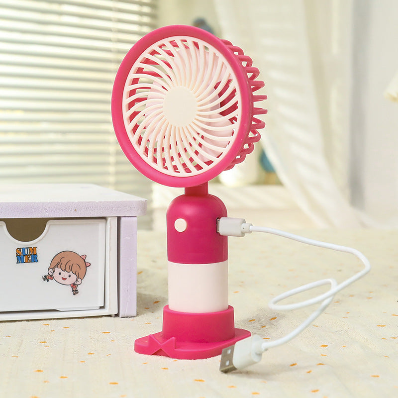 Rosa bærbar minivifte for kvinner, lett og stillegående, gir behagelig kjøling hele sommeren. Praktisk USB-lading.