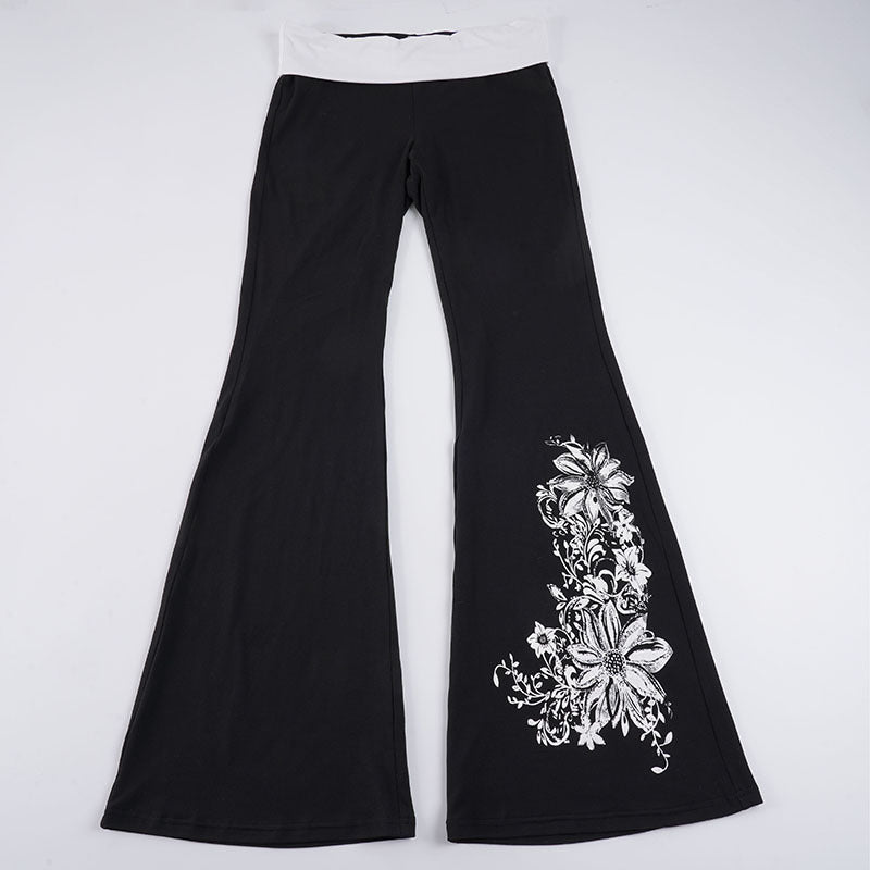 Elegante dame flared yoga-bukser med høy midje og levende blomstertrykk, perfekt for stil og komfort i hverdagen.