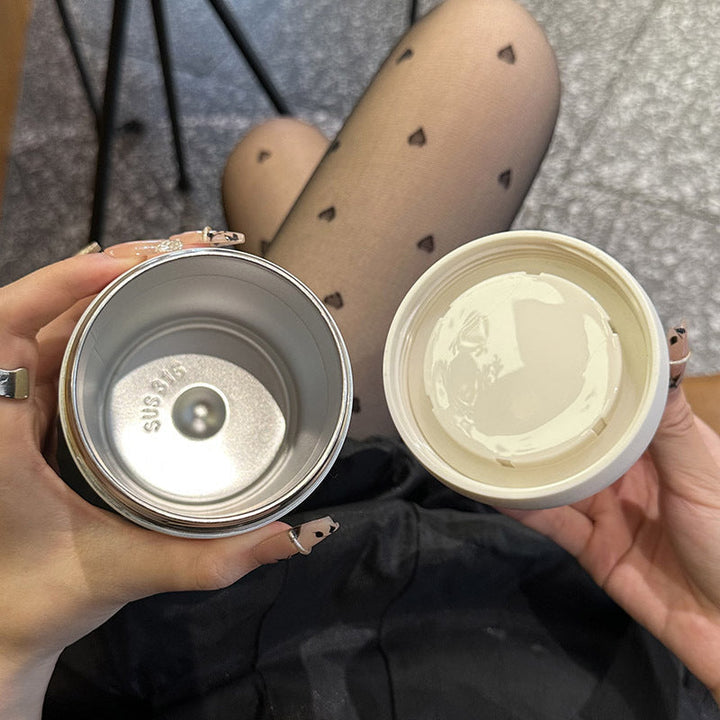 Hvit isolert vannflaske for kvinner, 420ml. Bærbar design med håndtak, perfekt for trening og aktiv bruk.