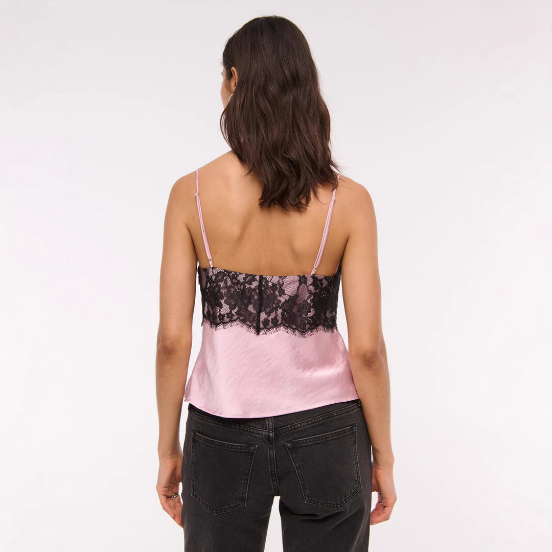 Svart V-halsbluse med knutedetalj for dame. Elegant, trendy og komfortabel for både kontor og fritid.