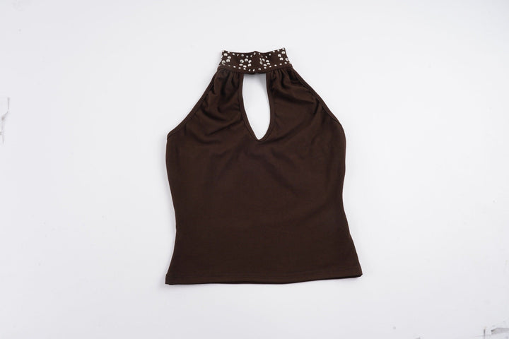 Damer haltertop, elegant og glitrende. Perfekt valg for en moderne og festlig look, sommer som kveld.