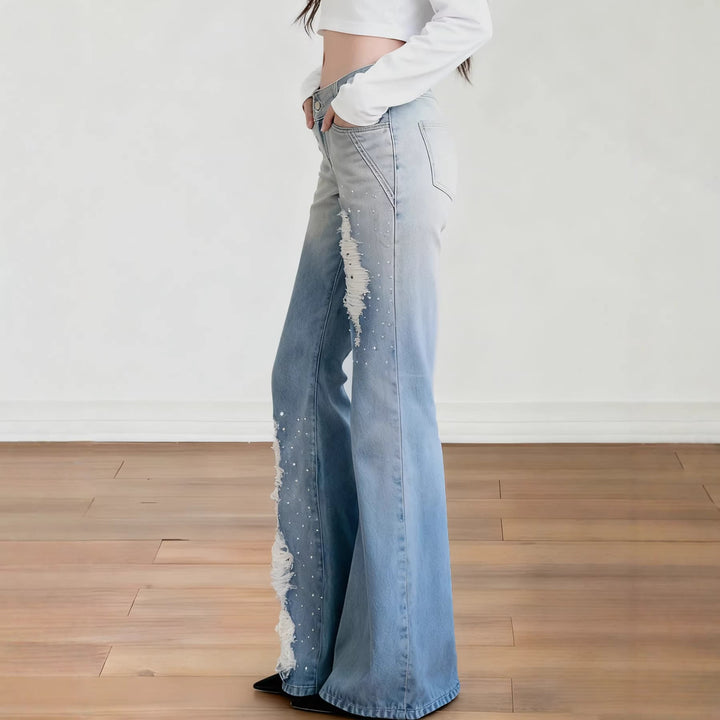 Dame bootcut jeans med trendy revner og komfortabel passform. Perfekt som hverdagsjeans.