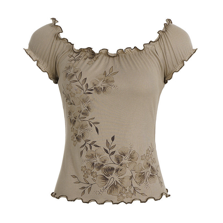 Stilfull khaki dametopp med blomstermønster og feminine volanger; en elegant og moderne sommertopp.